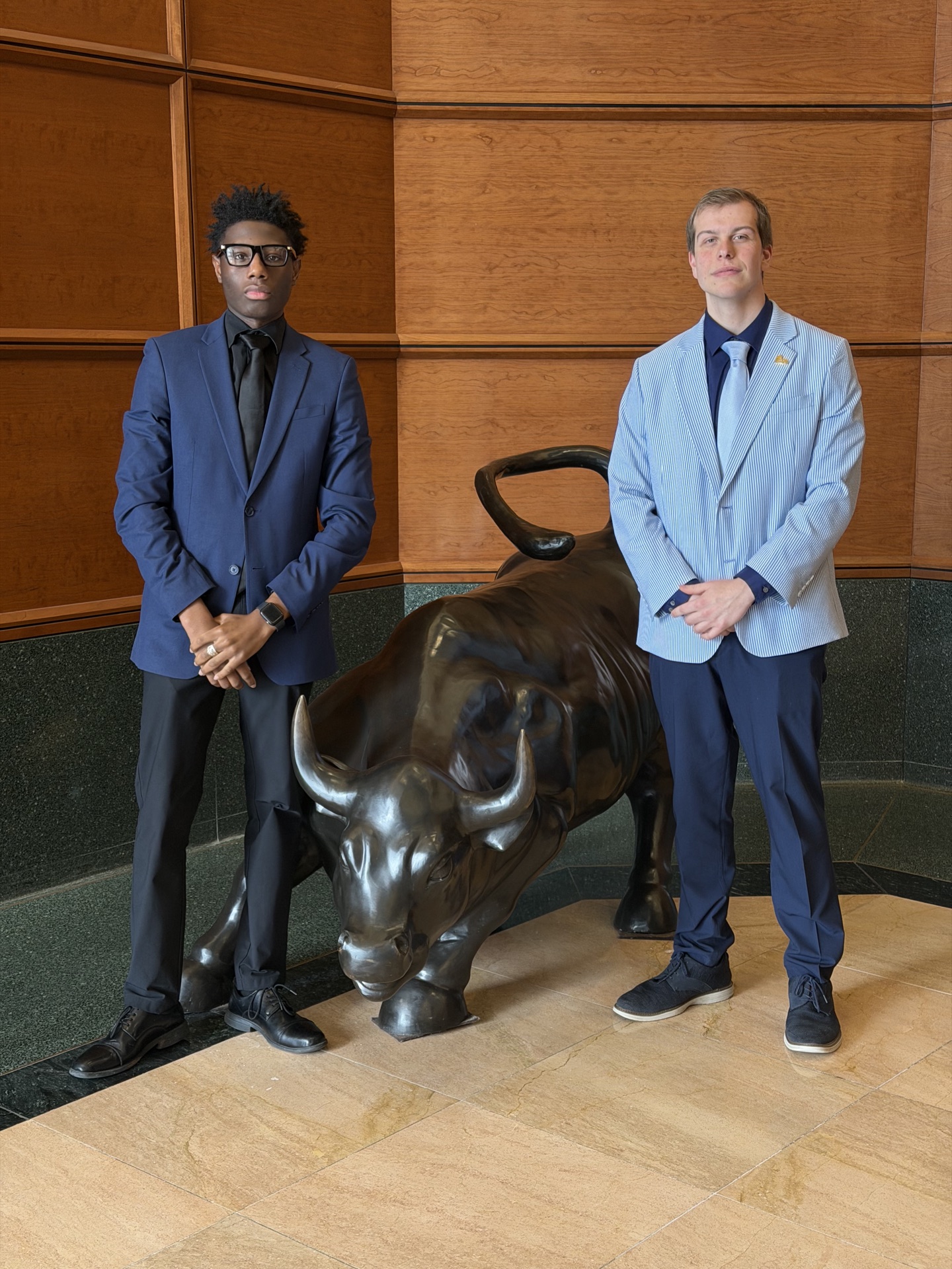 Tiber and Laurel team members with bull statue